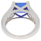 Princess blue sapphire sterling silver ring showcasing a brilliant princess cut gemstone from inside view.